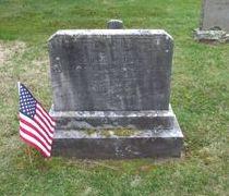 American Flag near a headstone